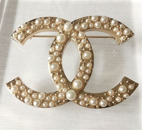 chanel cc brooch gold|Chanel pearl brooch price.